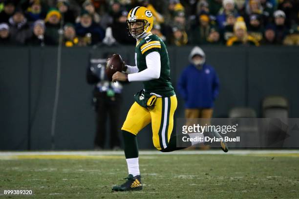 Brett Hundley of the Green Bay Packers runs with the ball in the second quarter against the Minnesota Vikings at Lambeau Field on December 23, 2017...