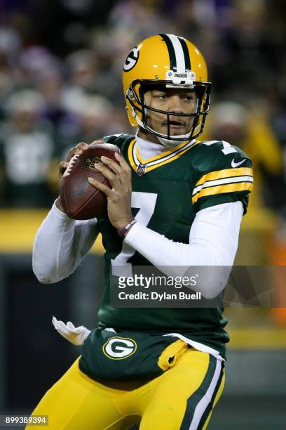 Brett Hundley of the Green Bay Packers drops back to pass in the second quarter against the Minnesota Vikings at Lambeau Field on December 23, 2017...