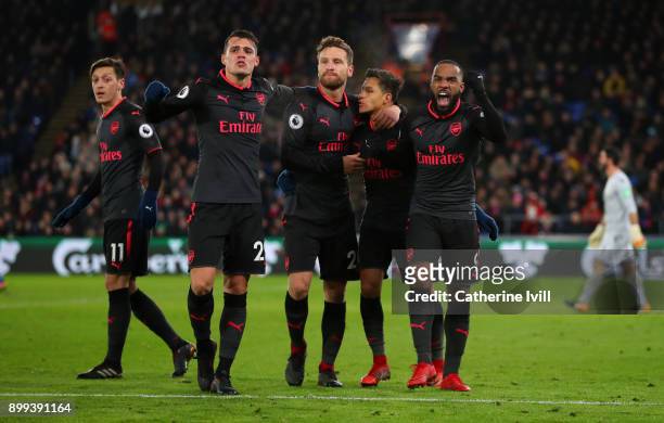 Alexis Sanchez of Arsenal celebrates with Granit Xhaka,Shkodran Mustafi and Alexandre Lacazette of Arsenal during the Premier League match between...