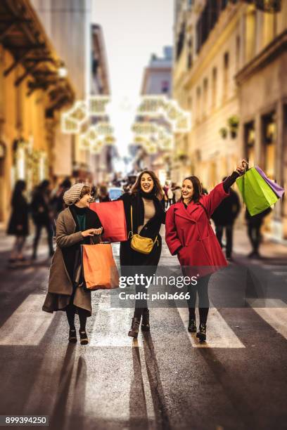 women shopping during winter sales in rome, italy - christmas in rome stock pictures, royalty-free photos & images