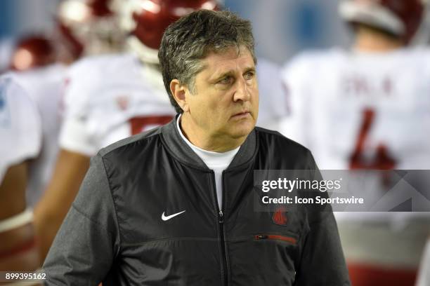 Washington State head coach Mike Leach walks off the field at the end of warmups prior to the Holiday Bowl game between the Washington State Cougars...