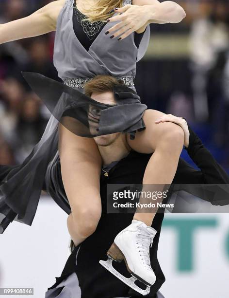 Russian ice dancer Nikita Katsalapov performs with partner Victoria Sinitsina's dress covering his face at the NHK Trophy in Osaka on Nov. 12, 2017....