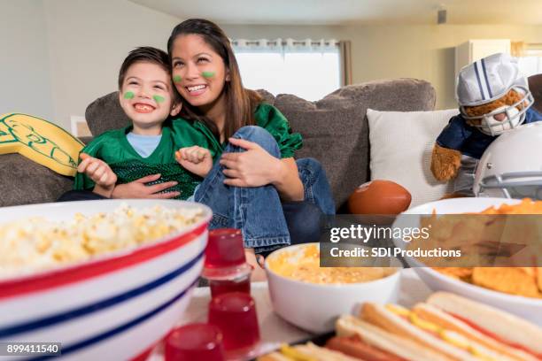 game day - family eating potato chips stock pictures, royalty-free photos & images