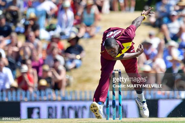 West Indies cricketer Carlos Brathwaite bowls during the first Twenty20 international cricket match between New Zealand and the West Indies at Saxton...