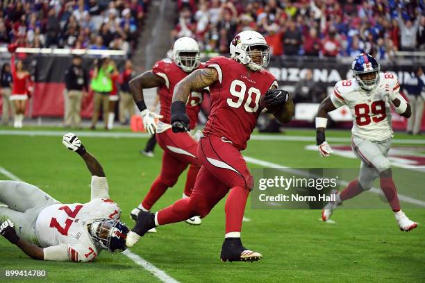 Robert Nkemdiche of the Arizona Cardinals runs for a touchdown after recovering a fumble against the New York Giants at University of Phoenix Stadium...