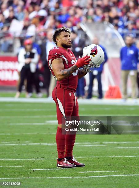Tyrann Mathieu of the Arizona Cardinals looks up at the scoreboard during a stop in play against the New York Giants at University of Phoenix Stadium...