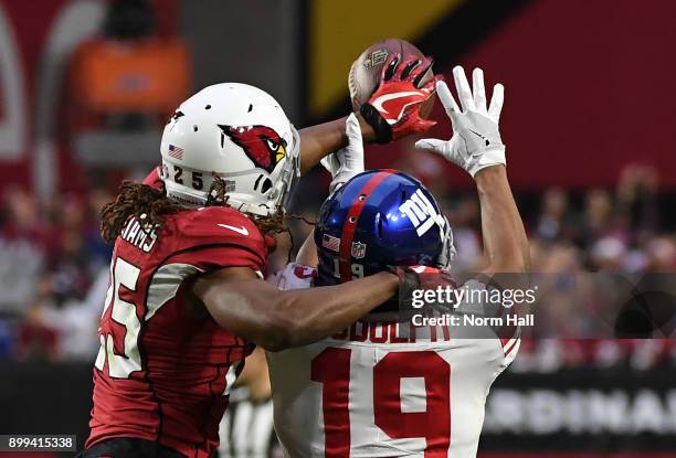 Tramon Williams of the Arizona Cardinals knocks a pass away from intended reciever Travis Rudolph of the New York Giants at University of Phoenix...