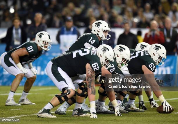 Michigan State Brian Lewerke lines up under center during the Holiday Bowl game between the Washington State Cougars and the Michigan State Spartans...