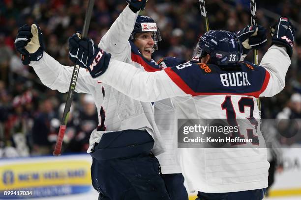 Samuel Bucek of Slovakia celebrates with teammates after scoring the winning goal against the United States in the third period during the IIHF World...