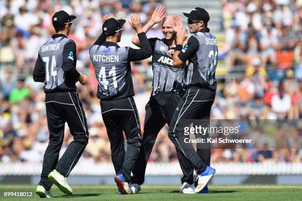 Seth Rance of New Zealand is congratulated by team mates after dismissing Chadwick Walton of the West Indies during game one of the Twenty20 series...