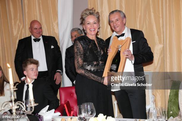 Son Roan Joseph Bronstein, Sharon Stone and Georg Walter, director of the tourist office, with present during the charity gala benefiting 'Planet...