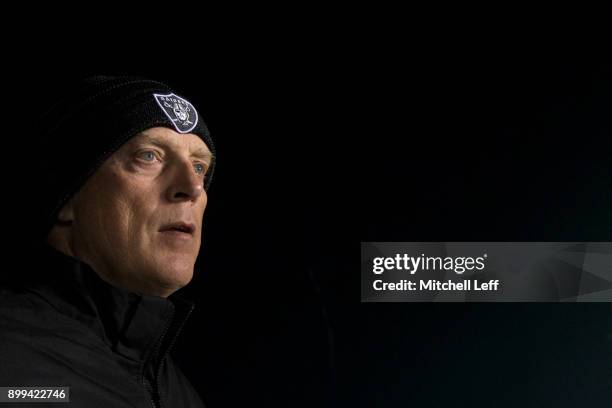 Head coach Jack Del Rio of the Oakland Raiders walks on the field prior to the game against the Philadelphia Eagles at Lincoln Financial Field on...
