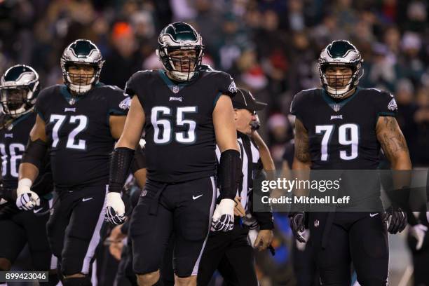 Halapoulivaati Vaitai, Lane Johnson, and Brandon Brooks of the Philadelphia Eagles look on against the Oakland Raiders at Lincoln Financial Field on...