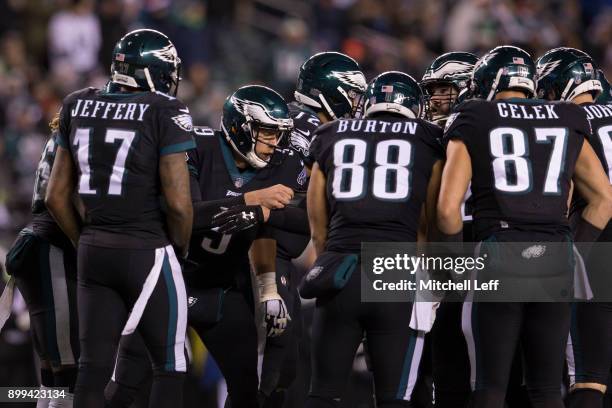 Nick Foles of the Philadelphia Eagles calls a play in the huddle for Alshon Jeffery, Trey Burton, Brent Celek, and Lane Johnson against the Oakland...