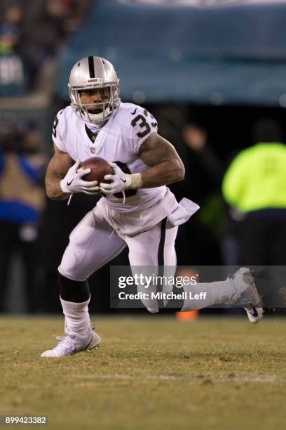 DeAndre Washington of the Oakland Raiders runs with the ball against the Philadelphia Eagles at Lincoln Financial Field on December 25, 2017 in...