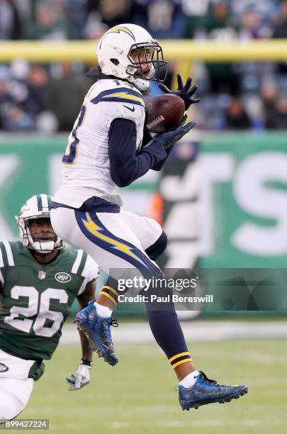 Keenan Allen of the Los Angeles Chargers leaps to catch a pass for a first down late in the fourth quarter of an NFL football game against the New...