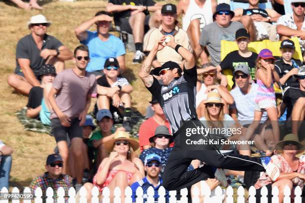 Doug Bracewell of New Zealand fields the ball during game one of the Twenty20 series between New Zealand and the West Indies at Saxton Field on...