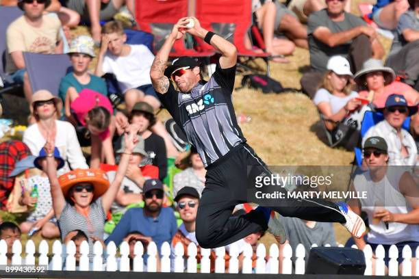 New Zealand's Doug Bracewell attempts to catch a ball from West Indies batsman Ashley Nurse during the first Twenty20 international cricket match...