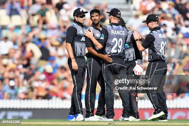 Ish Sodhi of New Zealand is congratulated by team mates after dismissing Andre Fletcher of the West Indies during game one of the Twenty20 series...