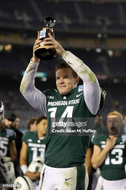 Brian Lewerke of the Michigan State Spartans is named offensive player of the game after defeating the Washington State Cougars 42-17 in the SDCCU...