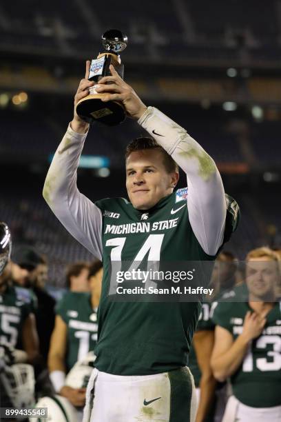 Brian Lewerke of the Michigan State Spartans is named offensive player of the game after defeating the Washington State Cougars 42-17 in the SDCCU...