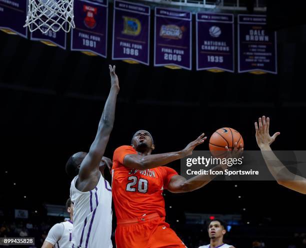 Sam Houston State Bearkats guard Jamal Williams shoots a hook shot against LSU Tigers forward Duop Reath on December 19, 2017 at Pete Maravich...