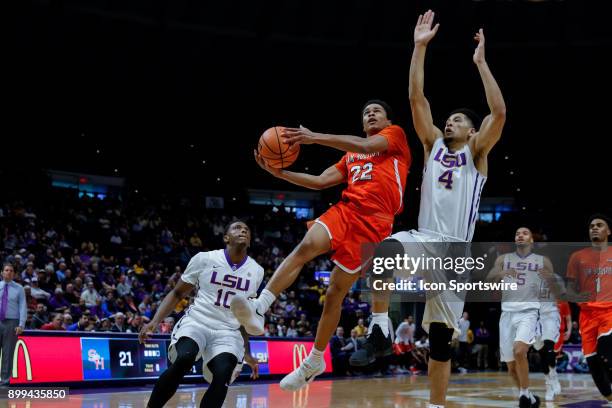 Sam Houston State Bearkats guard Marcus Harris drives to the basket against LSU Tigers guard Skylar Mays on December 19, 2017 at Pete Maravich...