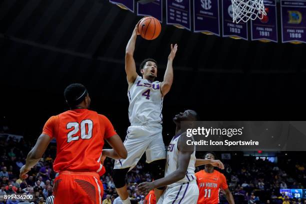 Tigers guard Skylar Mays shoots against Sam Houston State Bearkats guard Jamal Williams on December 19, 2017 at Pete Maravich Assembly Center in...