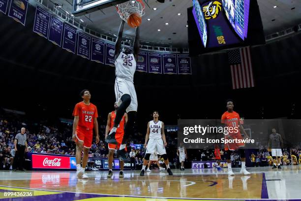 Tigers forward Mayan Kiir dunks the ball against Sam Houston State Bearkats guard Marcus Harris on December 19, 2017 at Pete Maravich Assembly Center...