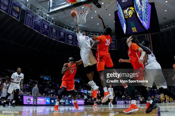 Tigers guard Brandon Rachal shoots a lay up against Sam Houston State Bearkats forward Chidozie Ndu on December 19, 2017 at Pete Maravich Assembly...