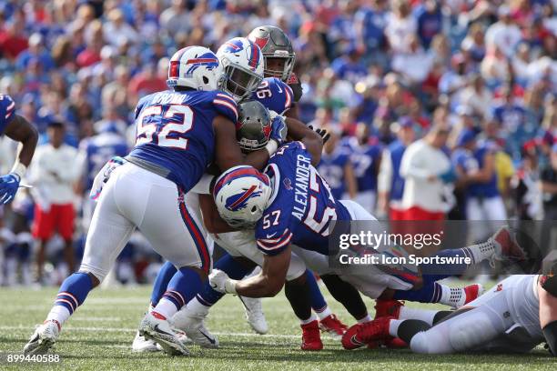 Tampa Bay Buccaneers running back Doug Martin is stopped by Buffalo Bills middle linebacker Preston Brown and Buffalo Bills outside linebacker...