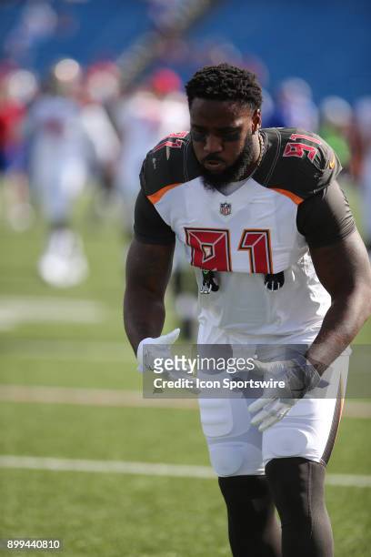 Tampa Bay Buccaneers defensive end Robert Ayers warms up prior to the start of a National Football League game between the Tampa Bay Buccaneers and...