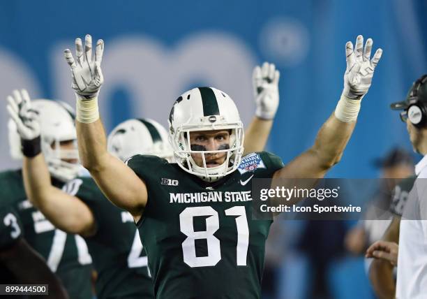 Michigan State Spartans tight end Mike Sokol signals the start of the fourth quarter of the Holiday Bowl played against the Washington State Cougars,...