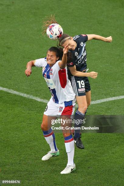 Katie Stengel of the Jets and Kristen McNabb of the Victory compete in the air during the round nine W-League match between the Melbourne Victory and...