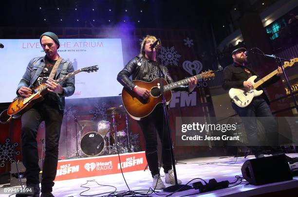 Musicians Tim Lopez, Tom Higgenson and Mike Retondo of Plain White T's perform onstage during the 'Live at the Atrium' Holiday Concert Series in...