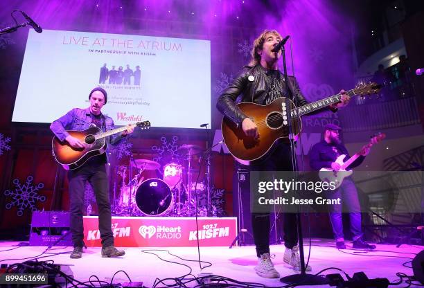 Musicians Tim Lopez, Tom Higgenson and Mike Retondo of Plain White T's perform onstage during the 'Live at the Atrium' Holiday Concert Series in...