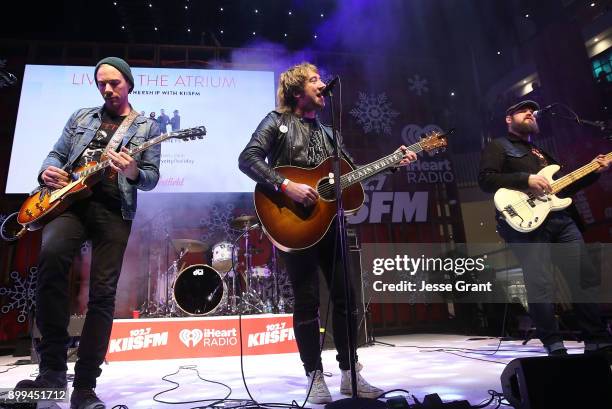 Musicians Tim Lopez, Tom Higgenson and Mike Retondo of Plain White T's perform onstage during the 'Live at the Atrium' Holiday Concert Series in...