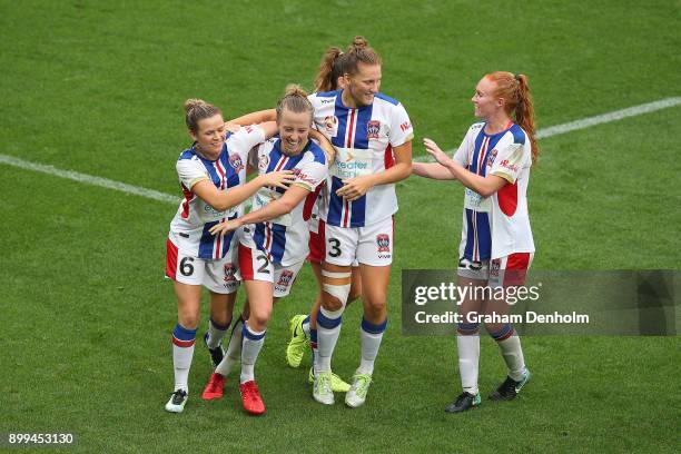 Hannah Brewer of the Jets celebrates her goal with her teammates during the round nine W-League match between the Melbourne Victory and the Newcastle...