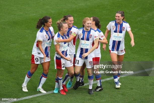 Hannah Brewer of the Jets celebrates her goal with her teammates during the round nine W-League match between the Melbourne Victory and the Newcastle...