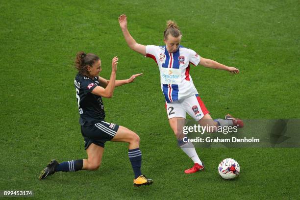 Hannah Brewer of the Jets gets a pass away under pressure during the round nine W-League match between the Melbourne Victory and the Newcastle Jets...