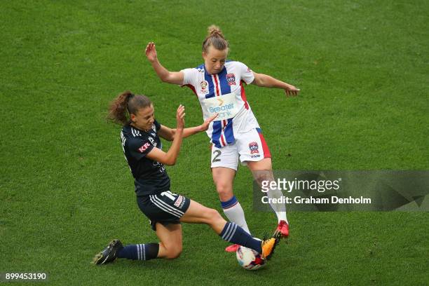 Hannah Brewer of the Jets is tackled during the round nine W-League match between the Melbourne Victory and the Newcastle Jets at AAMI Park on...
