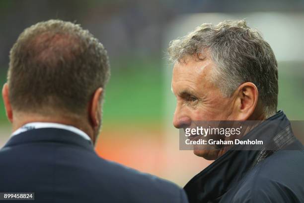 Newcastle Jets Head Coach Ernie Merrick talks to former Socceroos Head Coach Ange Postecoglou prior to the round 13 A-League match between the...