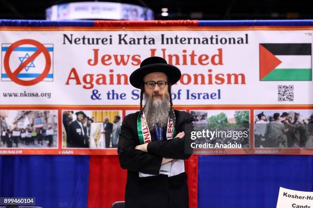 Anti-zionist Orthodox Jewish religious group member, known as Neturei Karta, Rabbi Dovid Feldman speaks to media at his group's stand during the 16th...