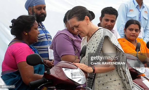 Chairperson of India's United Progressive Alliance Government and Congress Party President Sonia Gandhi meets handicapped people at a ceremony in New...