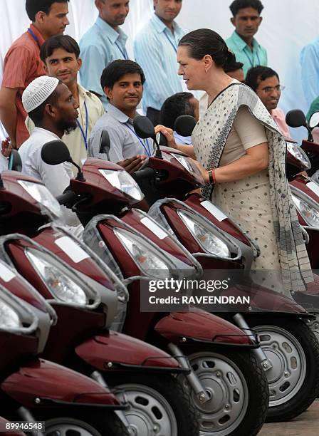 Chairperson of India's United Progressive Alliance Government and Congress Party President Sonia Gandhi meets handicapped people at a ceremony in New...