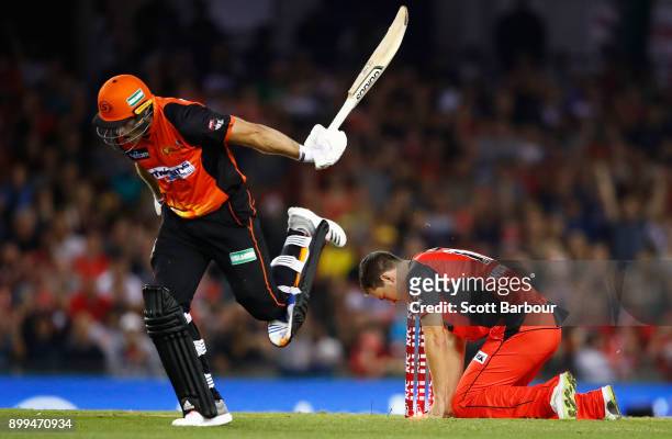 Jack Wildermuth of the Renegades unsuccessfully attempts to run out David Willey of the Scorchers during the Big Bash League match between the...