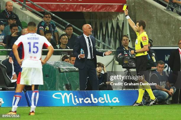 Referee Chris Beath gives Melbourne Victory Head Coach Kevin Muscat a yellow card during the round 13 A-League match between the Melbourne Victory...