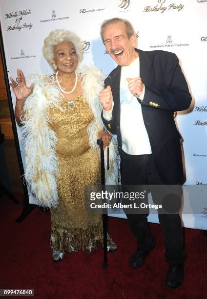 Actress Nichelle Nichols and publisher Kerry O'Quinn arrive for Nichelle Nichols' 85th Birthday Celebration held at La Piazza/The Grove on December...