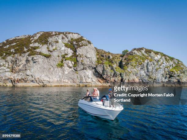 fishing from a motorboat - recreatieboot stockfoto's en -beelden