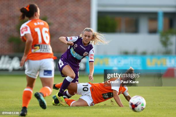 Rachel Hill of the Perth Glory is challenged by Katrina Gorry of the Roar during the round nine W-League match between the Perth Glory and Brisbane...